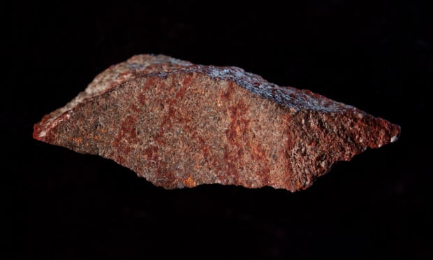 The earliest known drawing in history – a red, cross-hatched pattern – has been found in a cave in South Africa.