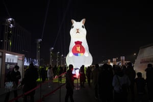 People gather near a large-scale illuminated lantern of a rabbit during New Year’s Eve celebrations in Gwanghwamun Square in Seoul