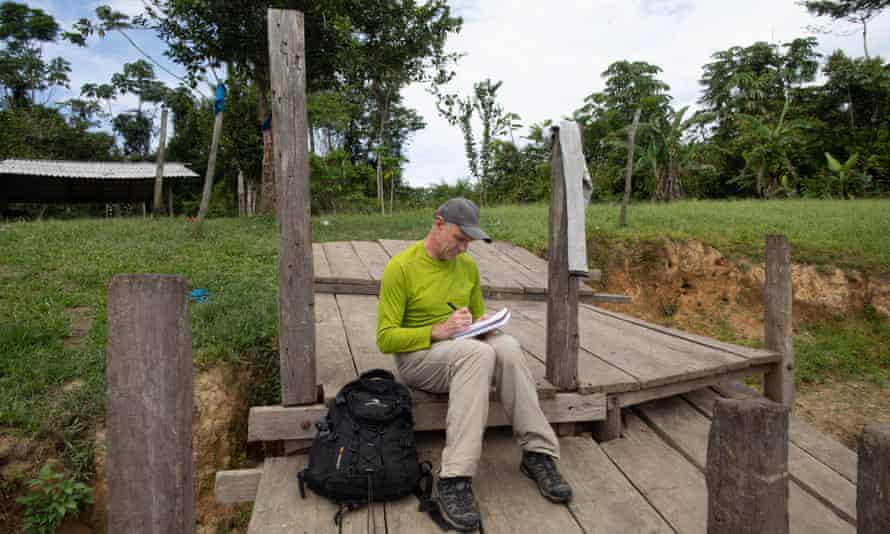 Dom Phillips takes notes on a previous trip to a remote part of Brazil.