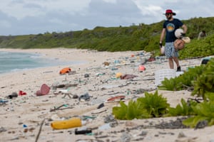 James Beard picks up rubbish on East beach.