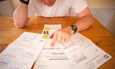 man worrying over his household bills