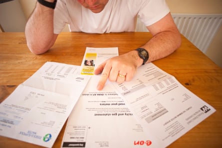 Man worrying over his household bills
