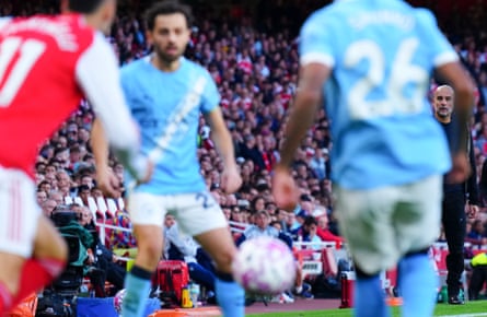 Pep Guardiola watches on as his Manchester City side let Arsenal hog the ball.