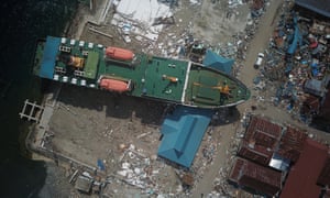 Aerial photo taken on Wednesday shows a cargo ship washed up in Donggala, Central Sulawesi.