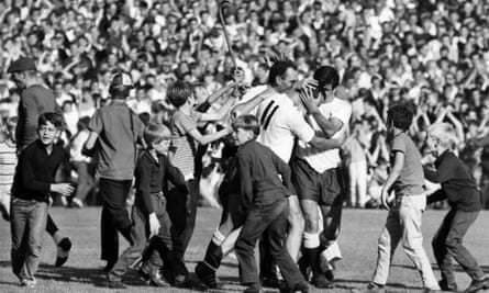 Spurs fans and players celebrate against Manchester United in September 1966 when they won 2-1.