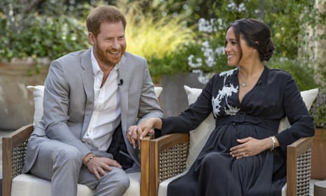 This image provided by Harpo Productions shows Prince Harry and Meghan, Duchess of Sussex, during an interview with Oprah Winfrey