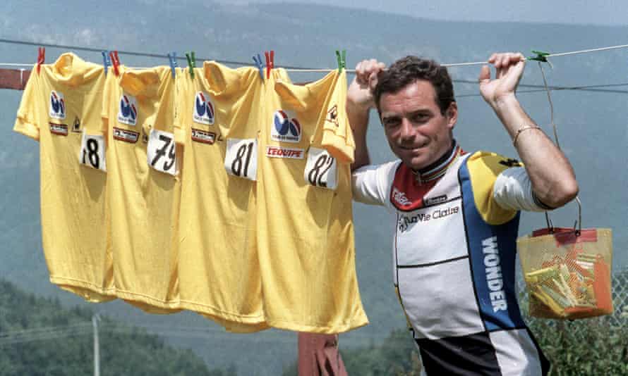 Bernard Hinault shows of his four yellow jerseys won in previous years (1978, 1979, 1981, 1982) on a rest day during the 1985 Tour de France, which he also won.