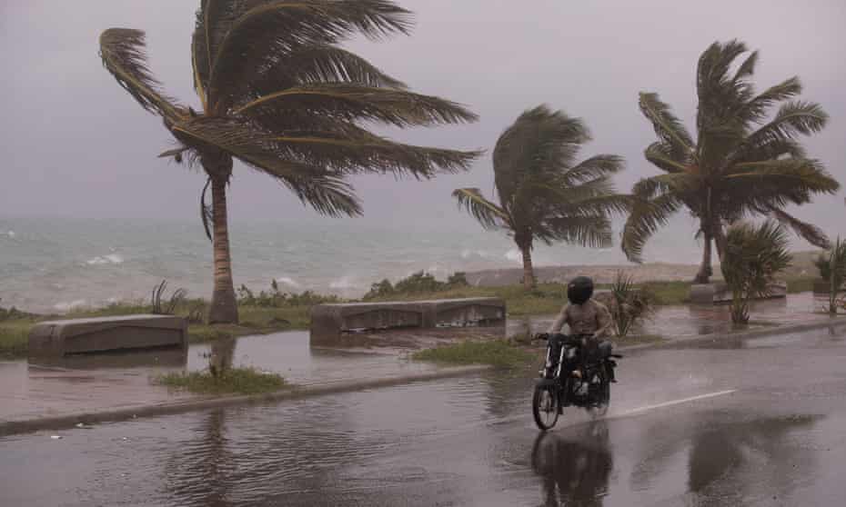 A motorcyclist rides through intense winds during the passage of Tropical Storm Elsa in Santo Domingo, Dominican Republic, in July