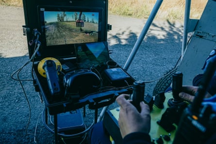 With the remote control, operator moves the grenade found at the demining site.