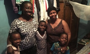 Gift Augustine with Grace and her children.