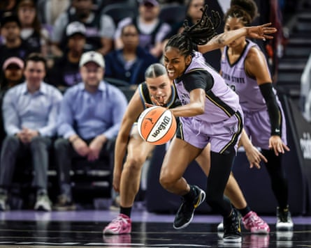 Tiffany Hayes chases the ball as Gabriela Jacquez looks on
