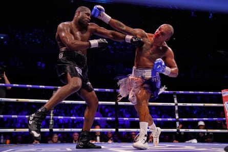 Fabio Wardley (right) and Daniel Dubois throw punches during their WBO world heavyweight title bout in Manchester.
