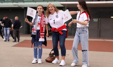 England v Austria: Group A - UEFA Women's EURO 2022<br>MANCHESTER, ENGLAND - JULY 06: England fans pose for a photo outside the stadium prior to the UEFA Women's EURO 2022 group A match between England and Austria at Old Trafford on July 06, 2022 in Manchester, England. (Photo by Charlotte Tattersall - UEFA/UEFA via Getty Images)