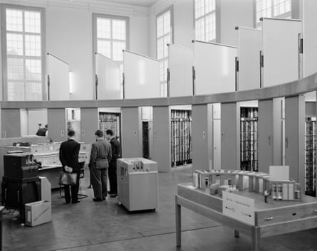 Delegates examine the Automatic Computing Engine, an early computer, at the Mechanisation of Thought Processes symposium at the National Physical Laboratory in Teddington, then in Middlesex, 24 November 1958.