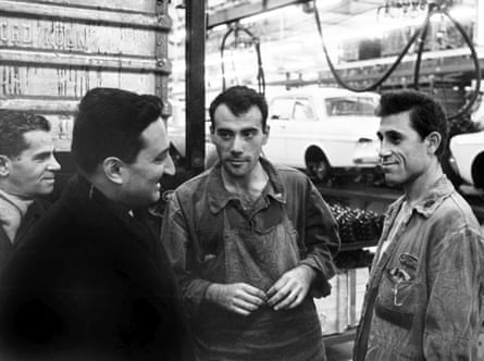 Four men in factory clothing.