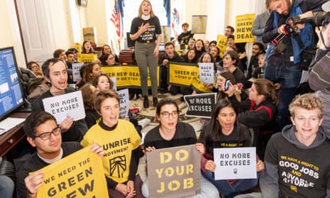 Members of the Sunrise Movement advocate for the Green New Deal in Nancy Pelosi’s office on 10 December. 
