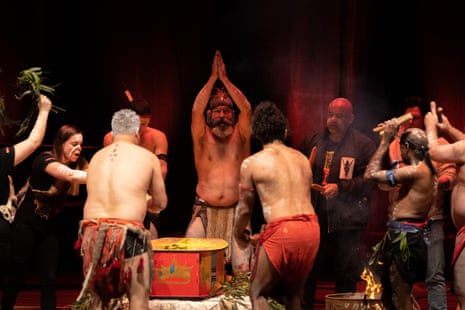 Indigenous performers conduct a smoking ceremony around the coffin of Uncle Jack Charles