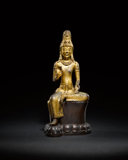 An 11th/12th-century gilt-bronze seated figure of Avalokiteśvara.