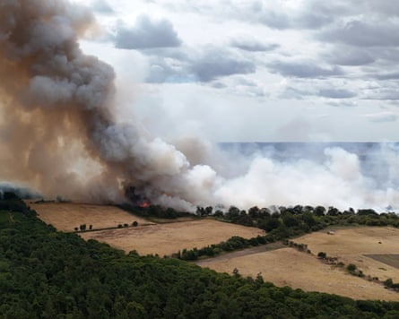 Smoke rises from a wildfire at Dunwich Heath