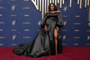 White Lotus’s Natasha Rothwell is majestic with a dash of leg in a black satin Ines Di Santo gown