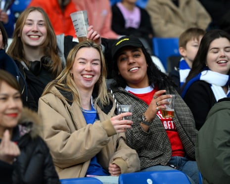 Fans of Chelsea and Arsenal are seen drinking in the stands prior to their WSL match last season.