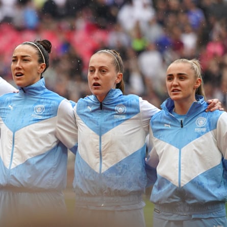 Manchester City players sing the national anthem