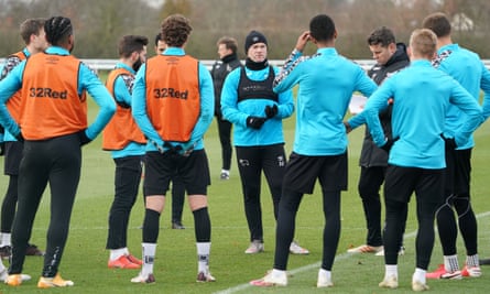 Wayne Rooney talks to his Derby players at the Moor Farm training ground, on which a loan was secured last October.