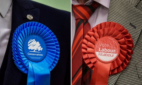 Conservative Party and Labour Party rosettes.