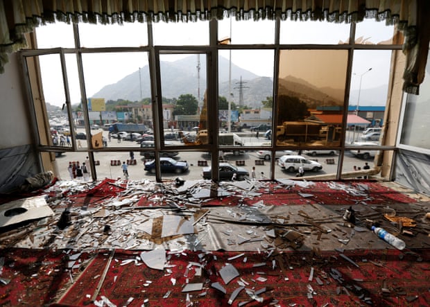 Broken glass and debris are seen inside a restaurant a day after a July 2016 suicide attack in the Afghan capital Kabul