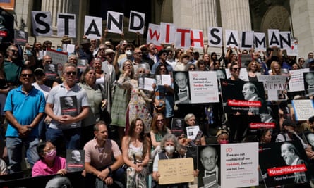 Writers gather to read selected works of Salman Rushdie in August 2022 outside the New York Public Library in New York.