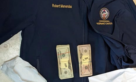 This photo, which was included in the indictment Robert Menendez, shows a jacket bearing his name along with cash from envelops found inside the jacket during a search by federal agents of the senator’s home in Harrison, New Jersey, in 2022.