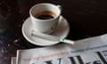A cup of coffee, cannabis joint and a newspaper