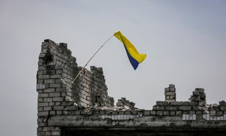 A Ukrainian national flag is seen near the frontline in the newly liberated village Neskuchne, in Donetsk region.