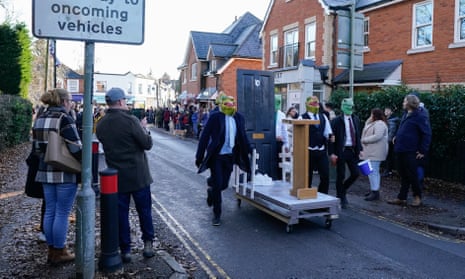 Competitors take part in the annual Windlesham Boxing Day Pram Race in Surrey