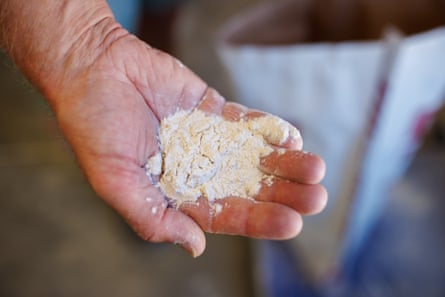 A hand holds some flour