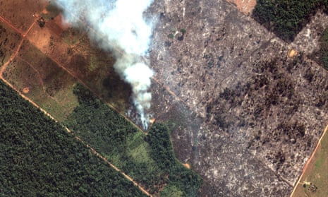 A satellite image shows smoke rising from Amazon forest fires in Rondônia state, Brazil
