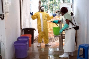 A health worker in the Katwa Ebola treatment centre exits one of the high-risk infection areas
