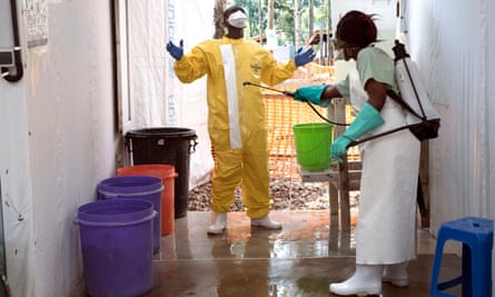A health worker in the Katwa Ebola treatment centre exits one of the high risk infection areas
