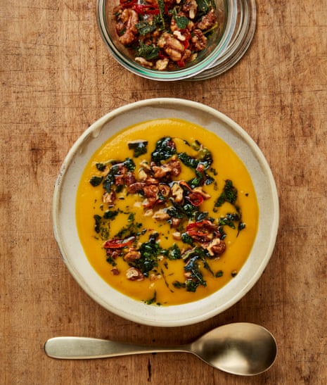 Cook up a big batch of Yotam Ottolenghi's roasted pumpkin soup with maple walnuts and herb oil.