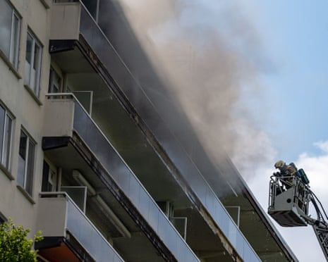 Firefighters pictured at the scene of a fire in an apartment building in the August Vermeylenlaan street in Antwerp.