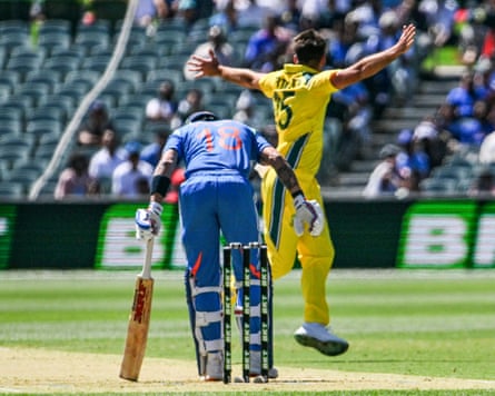 Australia's Xavier Bartlett celebrates dismissing Virat Kohli.