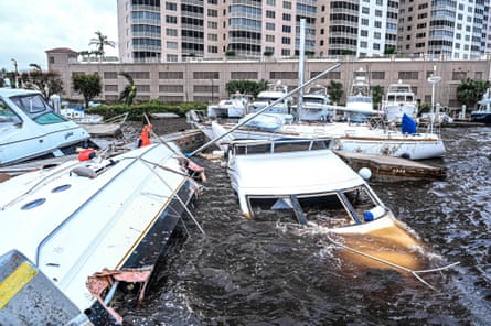 Boat are partially submerged at a marina in the aftermath of Hurricane Ian in Fort Myers, Florida, on Thursday.