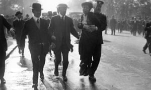 Suffragette Emmeline Pankhurst is removed from a Suffragette protest by a policeman.