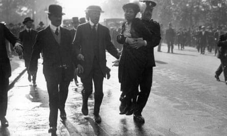 Suffragette Emmeline Pankhurst is removed from a Suffragette protest by a policeman.