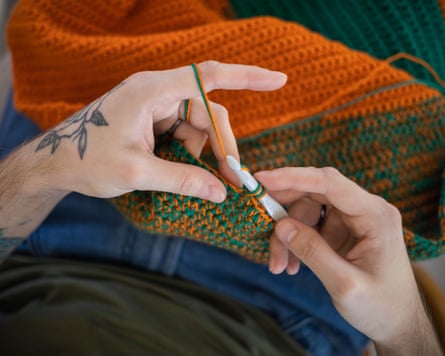 Man hands crocheting
