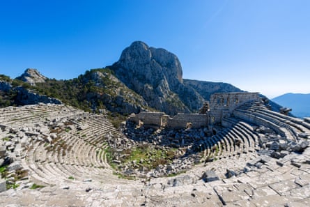 An amphitheatre on a mountainside with a blue sky behind