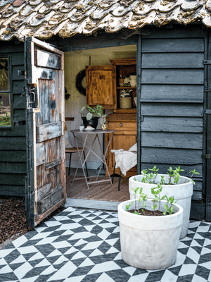 An original pantile-roofed outbuilding has been updated to make a fully functioning potting shed.