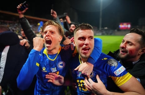 Players of Bosnia and Herzegovina celebrate after the team won the penalty shoot-out