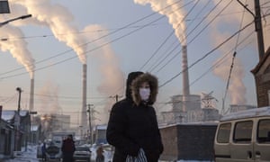 Smoke billows from industrial chimney stacks in Shanxi province, northern China