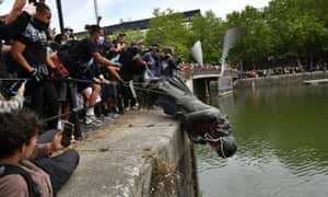 Protesters throw the statue of Edward Colston into Bristol harbour during a Black Lives Matter protest.